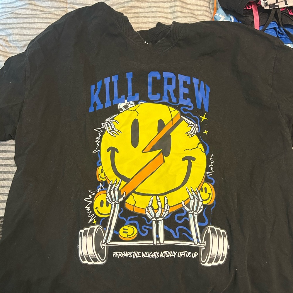 Black Graphic T-Shirt with Yellow Smiley Design